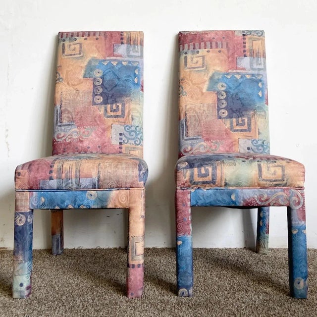 Exceptional set of 6 tags postmodern parsons dining chairs. Each feature a multi colored, orange, red and blue fabric.