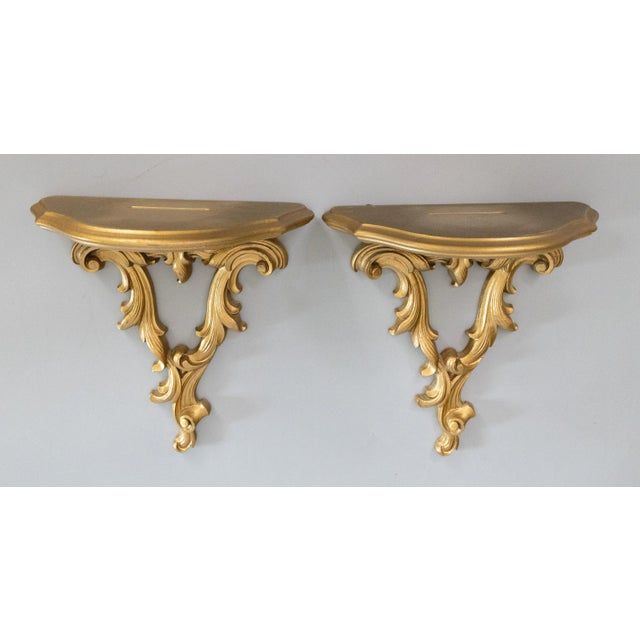 A lovely pair of Mid-Century Italian style carved gilt wood wall brackets or shelves. Perfect for displaying decorative...