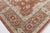 This "New Traditional-Inspired" rug is hand-woven in flat-weave wool with a softly variegated beige ground that shows...