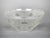 A clear, rounded white bowl decorated with acid-etched lozenges. Signed Daum Nancy France. This piece has an attribution...