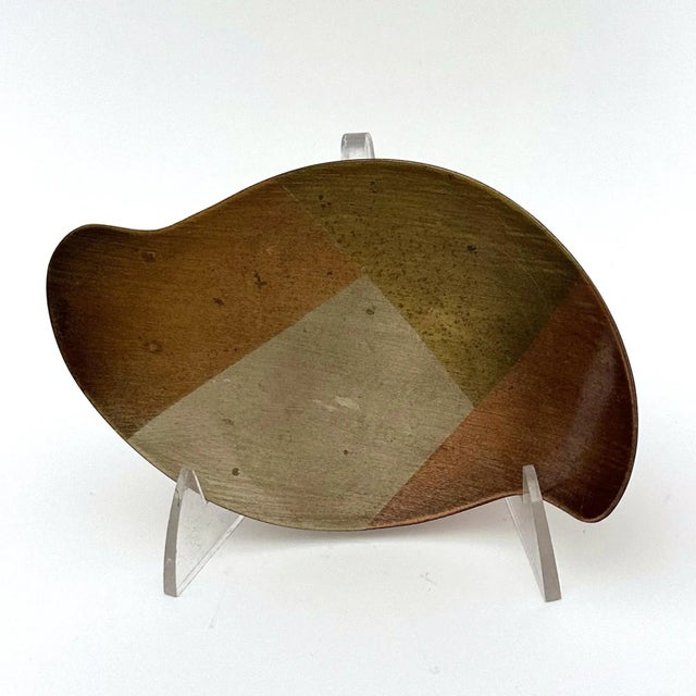 Mixed metals trinket dish created with a marriage of copper, brass and burnished brass. The dish has a biomorphic shape...