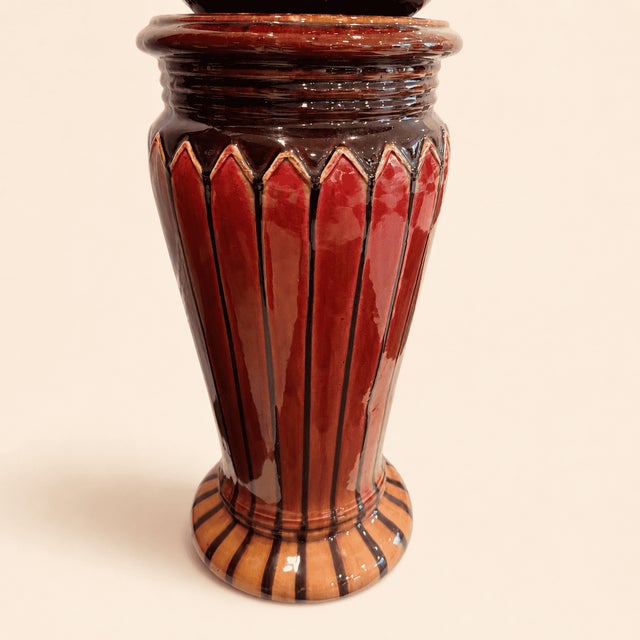 A two-piece majolica jardiniere and pedestal in that unmistakable turn-of-the-century palette. The pedestal wears deep...