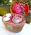 A vintage Chinese teapot and two cups are tucked into a colorful lined tea cozy basket. The finely woven basket is lined...