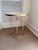 Versitile side table with a white and gray granite top sitting upon a weathered brass base. 16.5”W x 16.5”D x 19.75”H