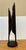 Design Plus Gallery presents an Unmarked Cast Metal Sculpture. This is a tall, abstract metal sculpture that has two...