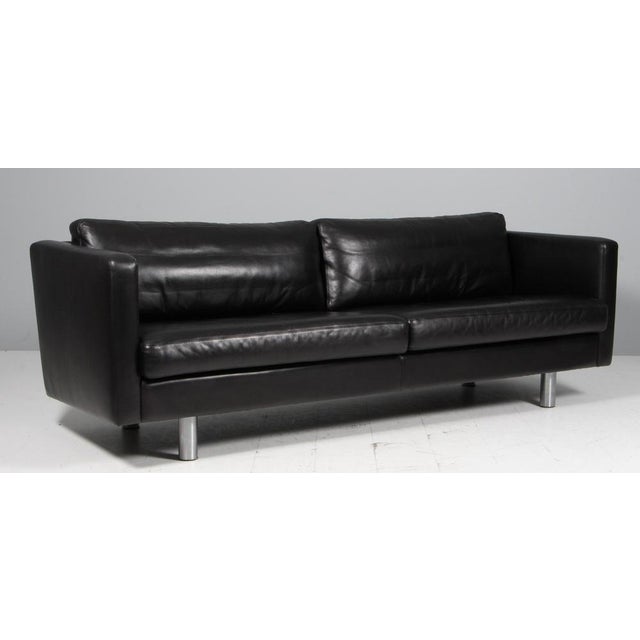 Erik Jørgensen three-seat original upholstered with black leather Legs of aluminium. Model 220, made by Erik Jørgensen....