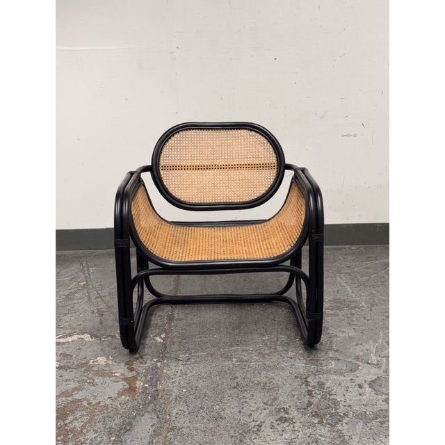 Design Plus Gallery presents the Nadie Rattan Accent Chair from Safavieh. A sculptural seating piece that balances crisp...