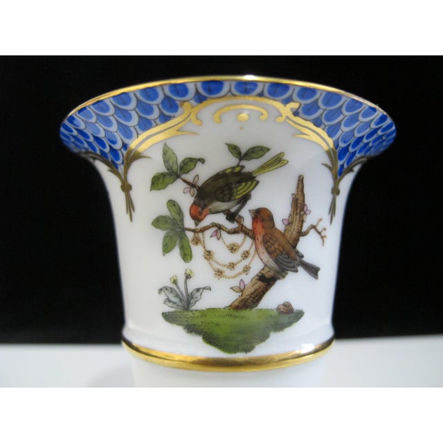 Hand-painted porcelain empire-style claw footed vase crafted by the prestigious Herend Porcelain of Hungary. Features the...