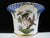 Hand-painted porcelain empire-style claw footed vase crafted by the prestigious Herend Porcelain of Hungary. Features the...