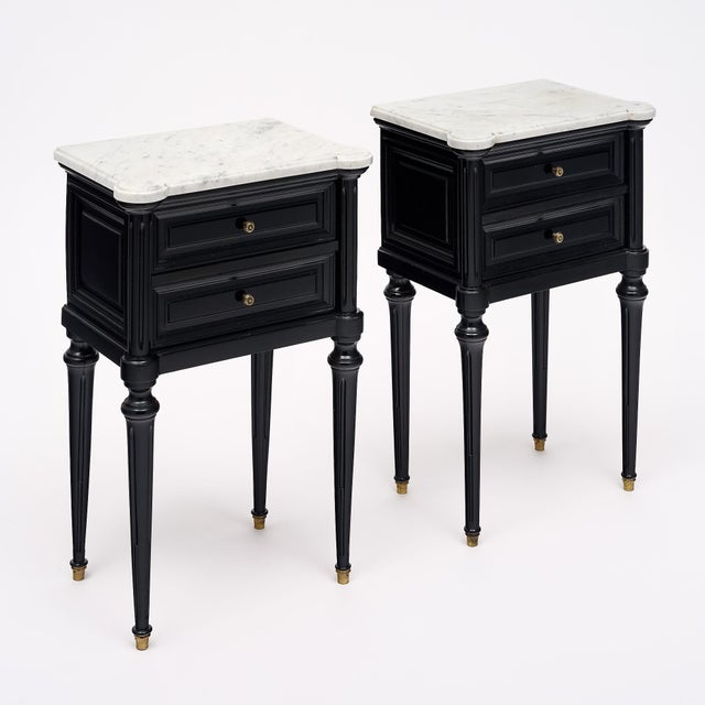 Pair of side tables from France in the Louis XVI style. This pair is made of solid wood construction, primarily mahogany....
