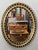 A fine Irish oval wall mirror from the early 19th century, featuring a distinctive frame of alternating raised ebonized...