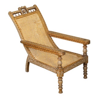 Early 20th Century Anglo-Indian Inlaid Plantation Chair with Scrolling Foliage and Extending Arms For Sale