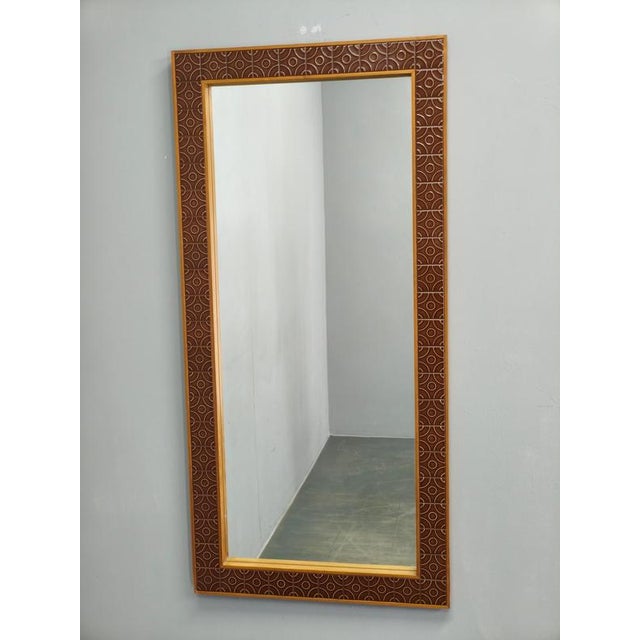 Decorative Danish modern wall mirror produced in the 1960s featuring a solid pine wood frame with integrated geometric...