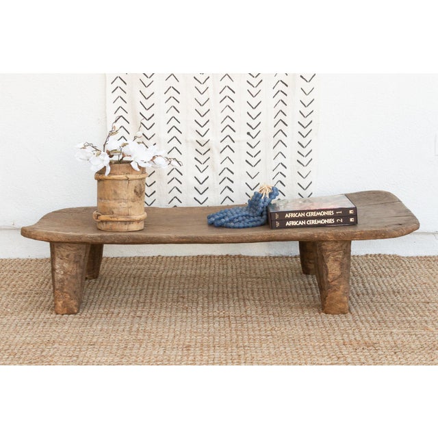 A unique addition to your home, this Senufo coffee table, crafted from a single log of wood, this antique Senufo table is...