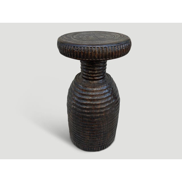 A century old mortar originally used to grind rice is repurposed into this one of a kind side table featuring our unique...