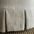 Bailey Slip Covered Ottoman in Linen Ticking Stripe With Pleated Skirt For Sale - Image 4 of 6