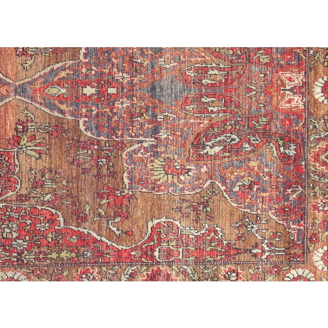 Hand-woven Turkish Oushak rug in wool, 4'9" x 9'3". Showcases geometric patterns in soft, restrained tones reflecting...