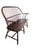 Vintage American Windsor settee crafted of solid poplar with a warm reddish-brown finish, featuring a graceful continuous...