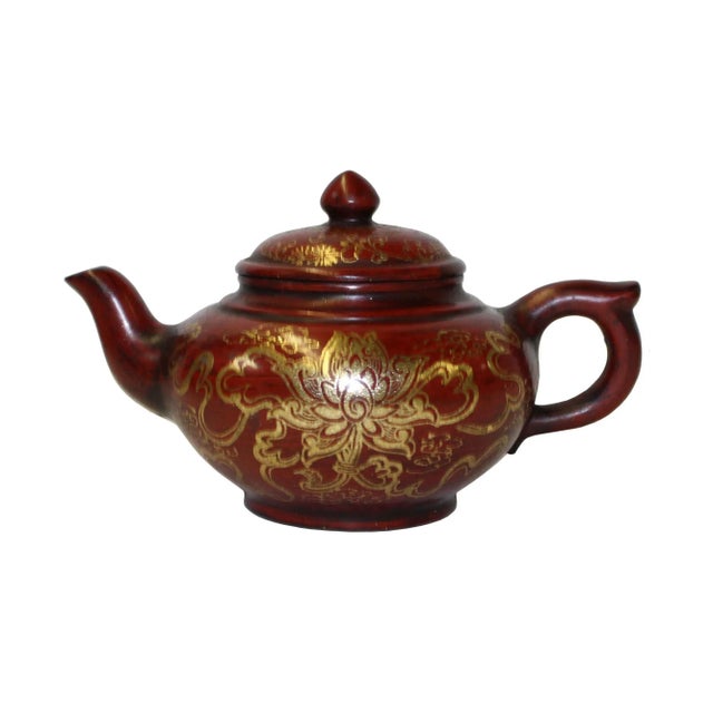 This is an art work display of oriental Chinese teapot which is made of Zisha clay and hand painted with golden color...