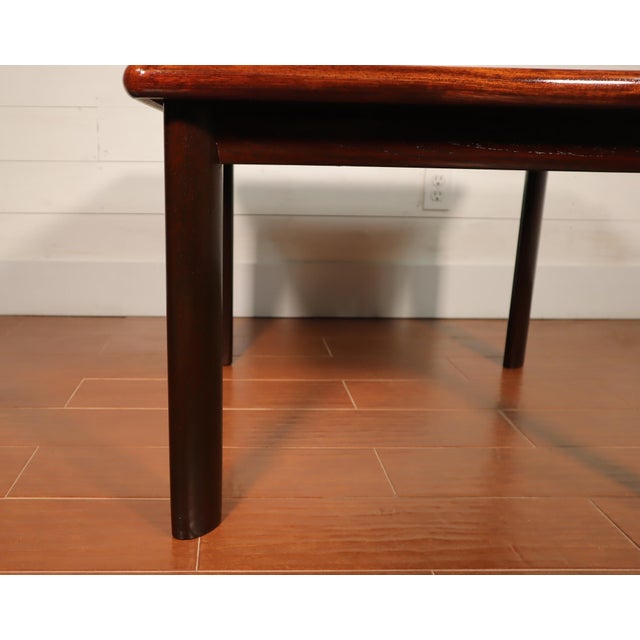 Beautiful vintage Danish rosewood and teak square coffee table made by Dyrlund (Made In Denmark). This table is in...