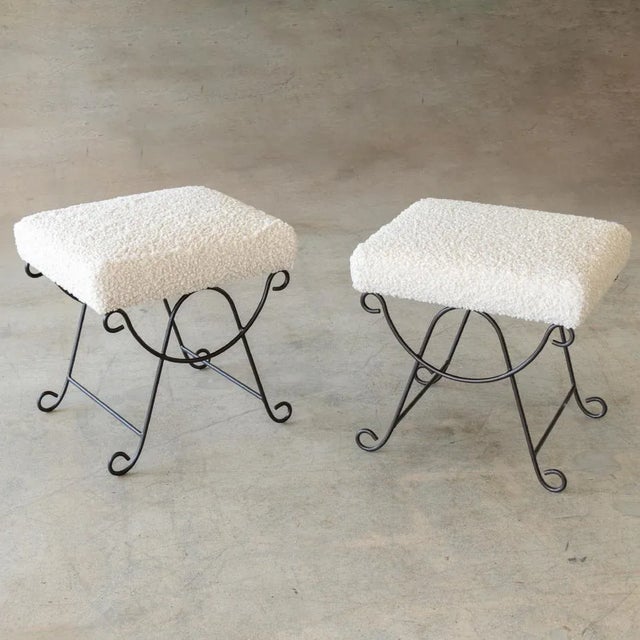 Iron stool with beautiful curved and looped base with matte black painted finish. Rectangular cushioned seat upholstered...