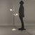 Floor lamp with adjustable light points, sliding and orientable, chromed and enamelled metal, enamelled aluminium. This...