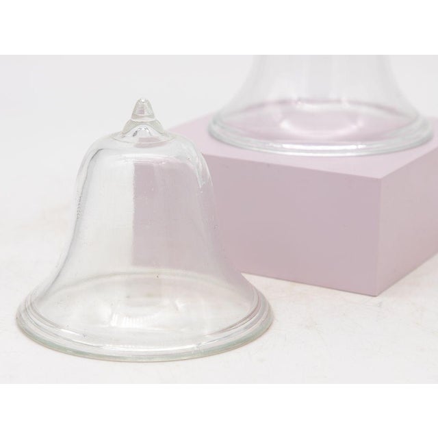 A set of three mini glass cloches. Ideal table top or bookshelf size. French midcentury. Wear consistent with age and use....