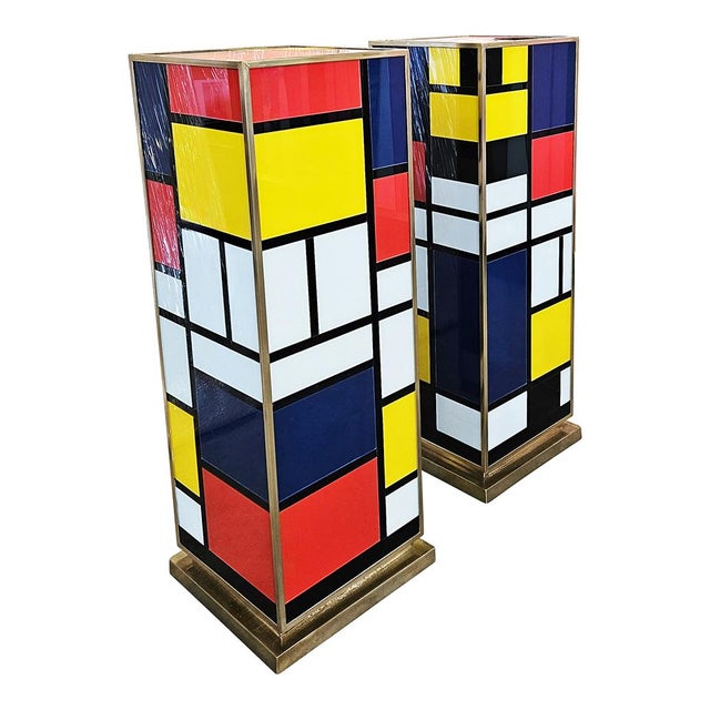 Pair of low decorative columns, entirely handmade, in brass and multicolored Murano glass. Dimensions each (WxDxH) 30 x...