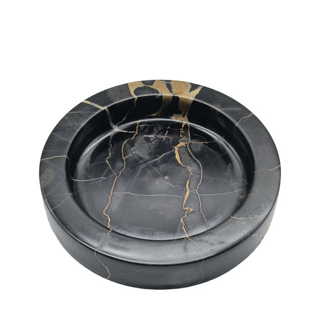 Small round coin tray in black Portoro marble, Italy, 1970s. Portoro marble is a prized variety of Italian marble from the...