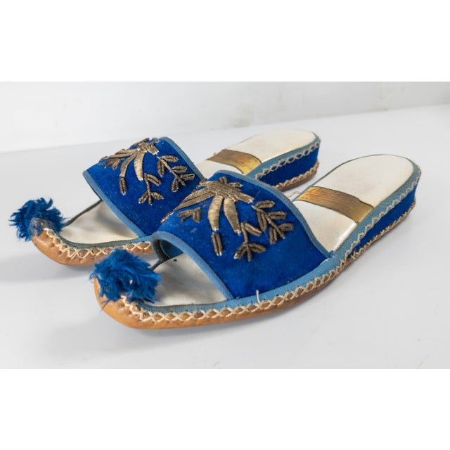 We are selling this gorgeous pair of Turkish slippers or shoes. The shoes have bright blue velvet and leather construction...
