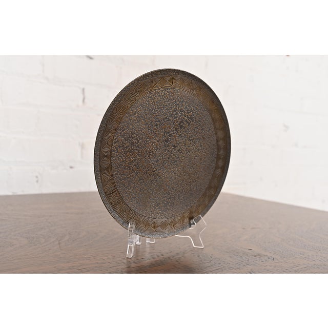 A gorgeous Arts & Crafts or Art Deco period patinated bronze footed charger plate, serving tray, or tazza with Greek Key...