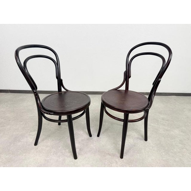 An exceptional and highly collectible pair of antique Model No. 14 bistro chairs, manufactured by the legendary Gebrüder...