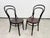 An exceptional and highly collectible pair of antique Model No. 14 bistro chairs, manufactured by the legendary Gebrüder...
