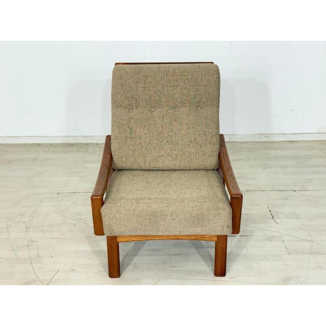 Elegant mid-century armchair designed by renowned Danish designer Grete Jalk and manufactured by Glostrup Møbelfabrik....