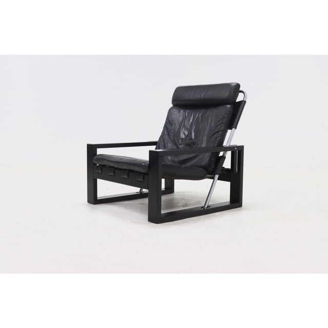 Brutalist lounge chair designed by Sonja Wasseur in the 1970s. The chair features a black lacquered oak wooden frame with...