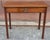 A 19th Century Federal Mahogany Small Writing Table Measures 32" in width and 19" in depth and 28" in height. Knee...