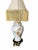 A striking chinoiserie table lamp featuring a glossy white ceramic ginger jar body decorated with orange and yellow...