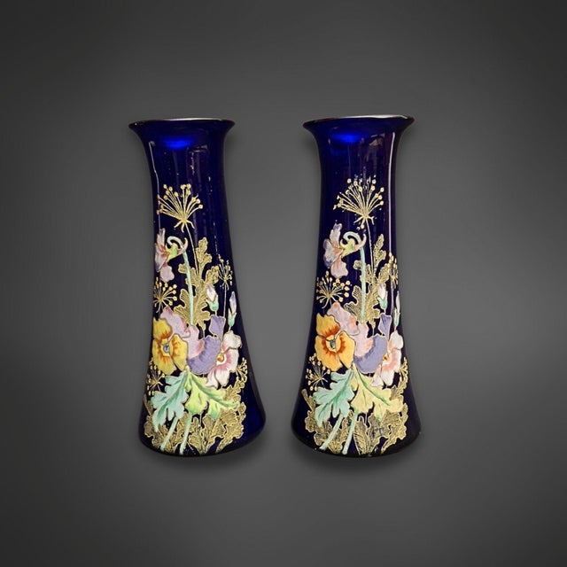 Add a touch of elegance and history to your home with this pair of Art Nouveau blue glass vases, made in France around...