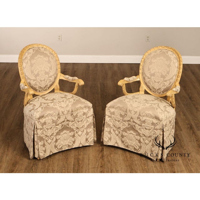 High Quality Pair Of Louis XVI Style Armchairs Featuring Painted Wood Frames With Oval Backs, Carved Details, And Scrolled...