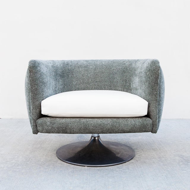 Authentic Knoll D'Urso swiveling lounge chair by Paul D’Urso, reupholstered in a gray green boucle with an off white...