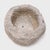 This stone basin was carved by hand over two centuries ago, sculpted from solid limestone with and irregular texture and...