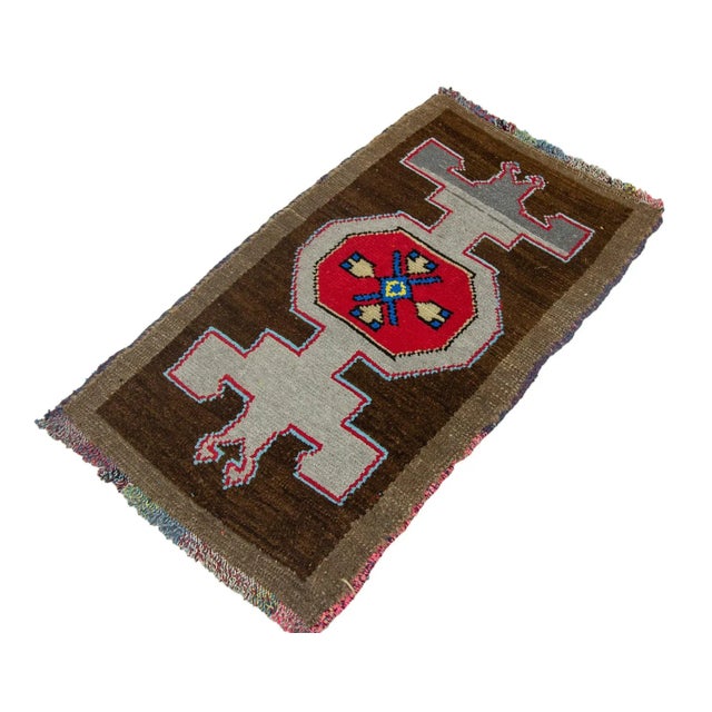 Vintage Handknotted decorative mini rug from Kars region of Turkey. Approximately 45-55 years old. In very good condition.