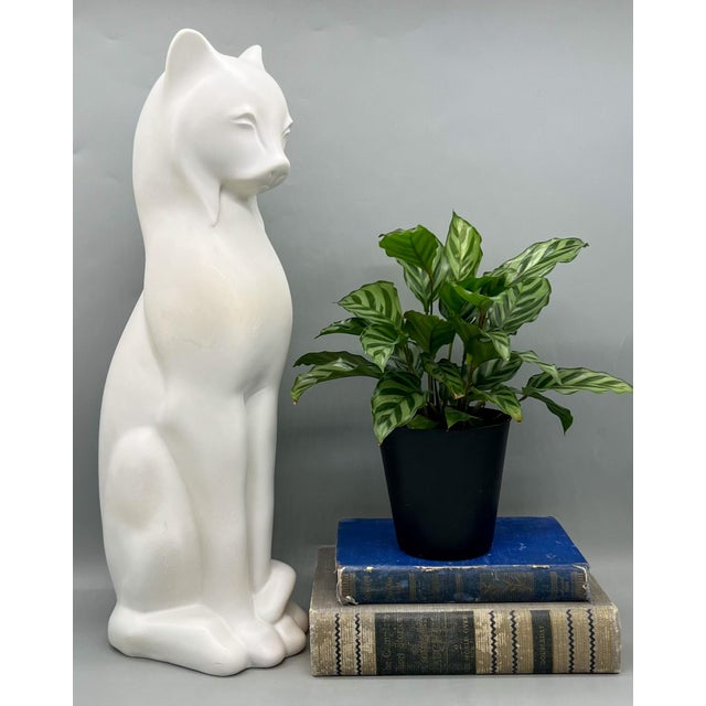 Exquisite, whimsical cat of stunning size and charming art deco style. Made in the mid to late 20th century with a maker's...