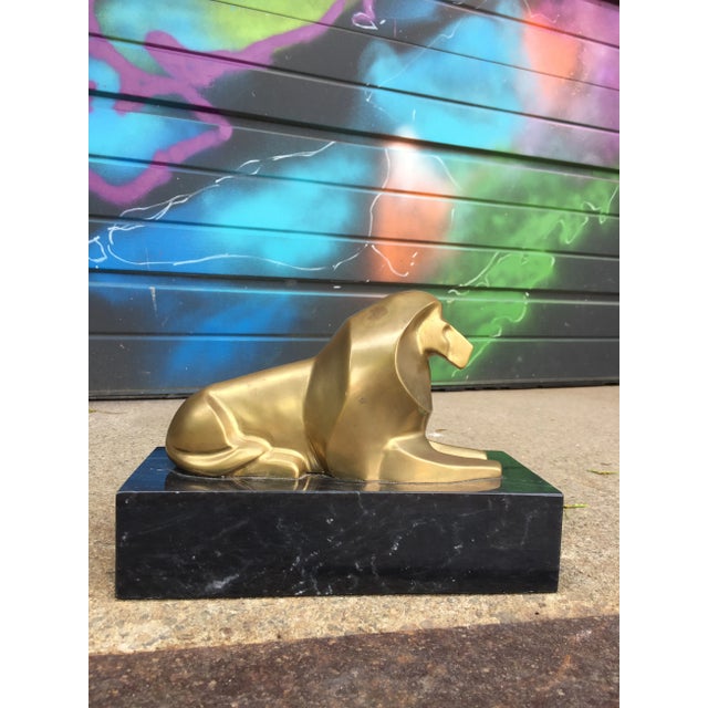 Vintage petite brass lion. Stylized brass on marble base. Slightly tarnished, could be brighter with shining
