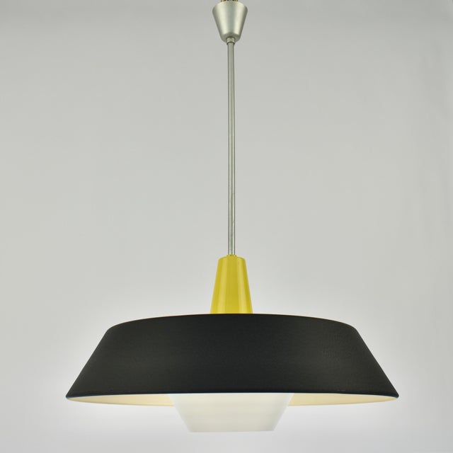 Original Philips Model NB23 pendant lamp, designed in 1959 by Niek Hiemstra. A stunning example of Dutch industrial...