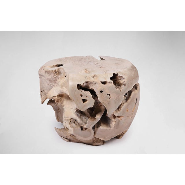 Inspired by the beauty of natural root form, this organic teak accent side table is handcrafted from one piece of salvaged...