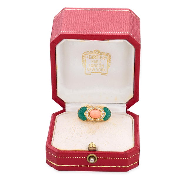 Cartier French diamond coral chrysoprase 18k yellow gold ring is a bold and artistic vintage design showcasing the iconic...