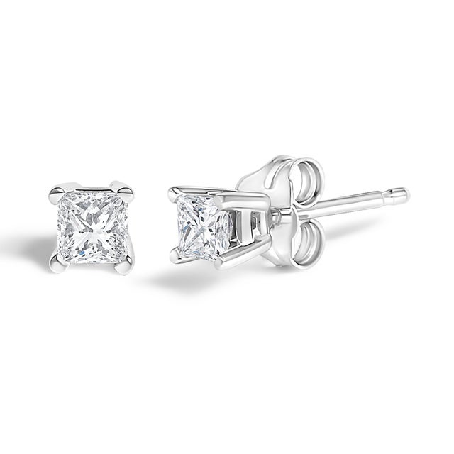 Immerse yourself in the understated elegance of these exquisite stud earrings, each graced with a naturally sourced,...