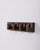 Brown plastic wall coat hanger with four foldable hooks, MiniVip model, designed by Benati and Brunori for Velca, 1970s....