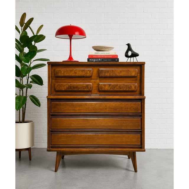 Mid Century Modern walnut dresser by United Furniture Co., c.1960s, featuring striking burl-front top drawers and rich,...
